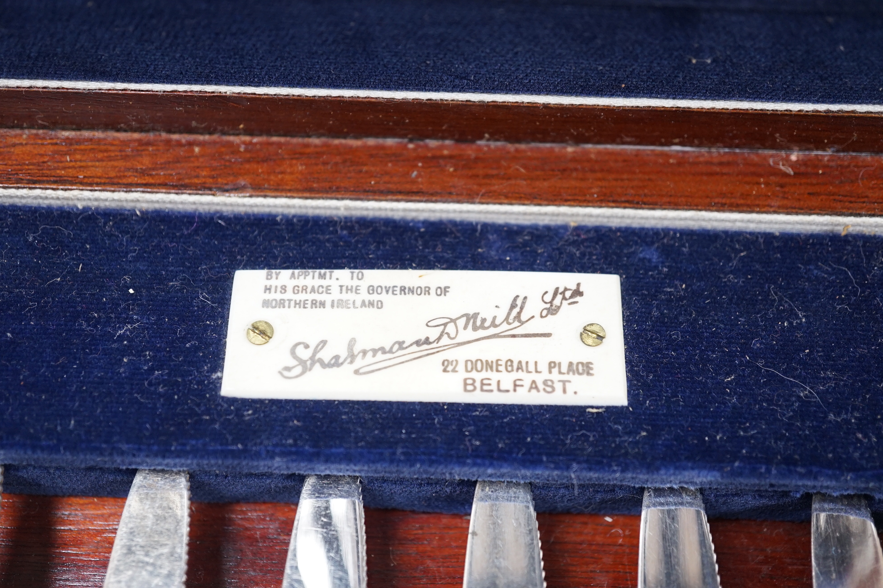 A Thai white metal cigarette box, stamped sterling, 14cm, and a similar sterling overlaid photograph frame, width 16cm